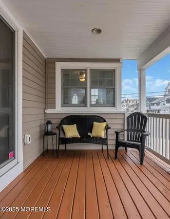 a view of a two chairs in the balcony