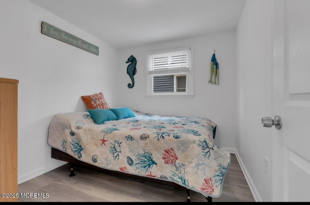 2020 Baltimore Avenue, Unit DOWN Seaside Heights, NJ 08751 - Photo 13 of 18 a bedroom with a bed and window