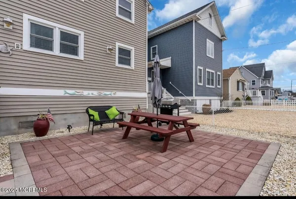 a view of a terrace with chairs and a fire pit