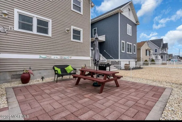 a view of a terrace with chairs and a fire pit