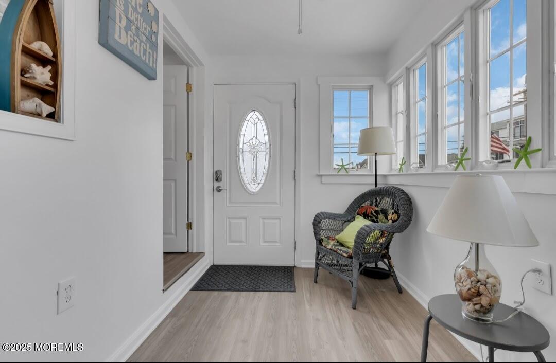 2020 Baltimore Avenue, Unit DOWN Seaside Heights, NJ 08751 - Photo 4 of 18 a living room with furniture and a table