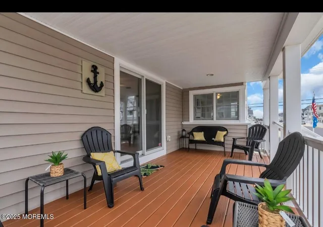 a outdoor living space with furniture and wooden floor