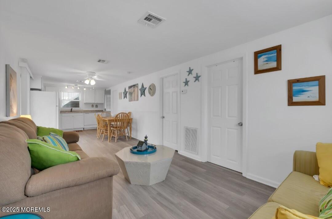 2020 Baltimore Avenue, Unit DOWN Seaside Heights, NJ 08751 - Photo 6 of 18 a living room with furniture and wooden floor