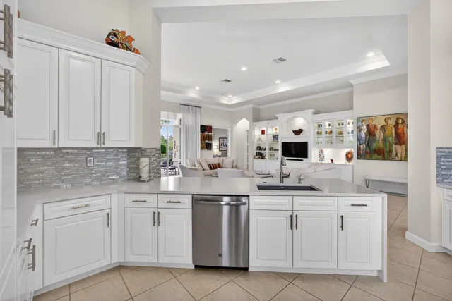 a bathroom with a toilet a sink a mirror and a shower