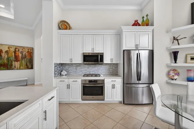 a bathroom with a double vanity sink toilet and shower