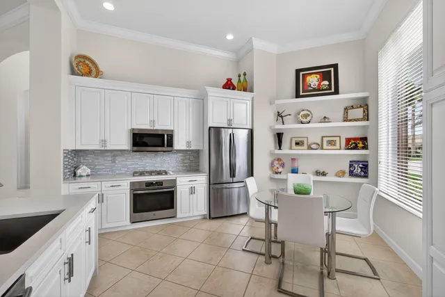 a bathroom with a double vanity sink toilet and a mirror