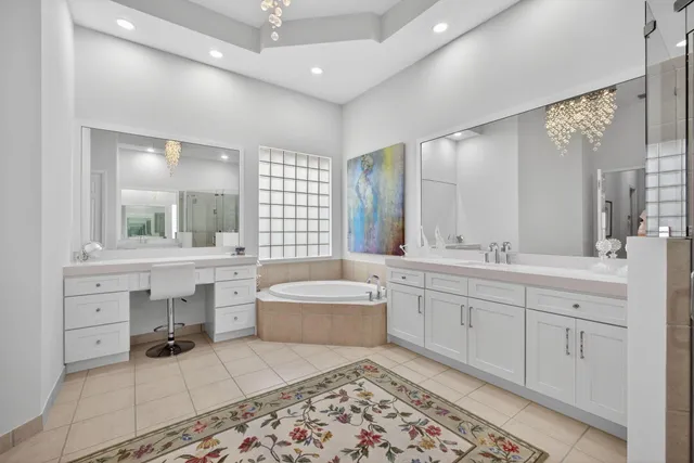 a view of a house with swimming pool and sitting area