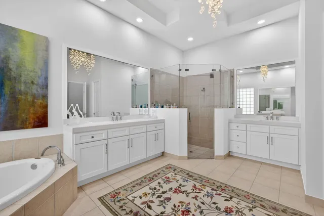 a front view of a house with a yard and fountain in middle of the house