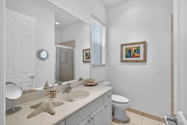 an aerial view of residential houses with outdoor space and river