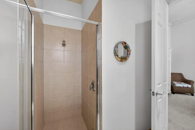 an aerial view of residential houses with outdoor space and trees