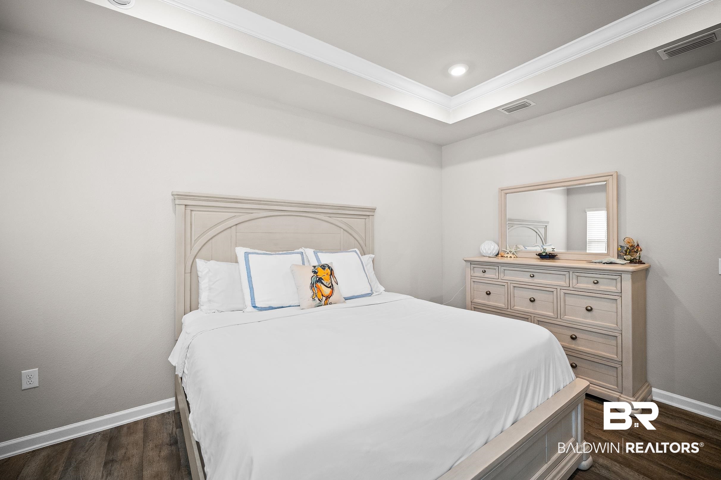 23997 Veranda Circle Elberta, AL 36530 - Photo 17 of 28 Bedroom featuring wood-finish flooring, a tray ceiling with recessed lighting, and crown molding