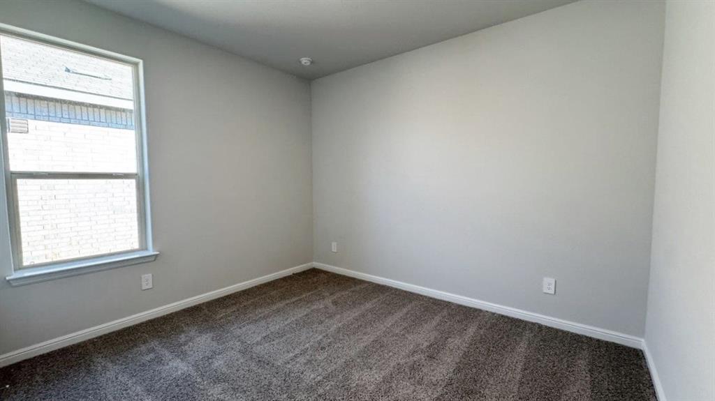 312 Potato Street Keene, TX 76059 - Photo 16 of 21 an empty room with a window