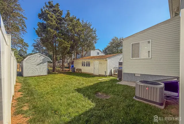 a view of a house with a yard and deck
