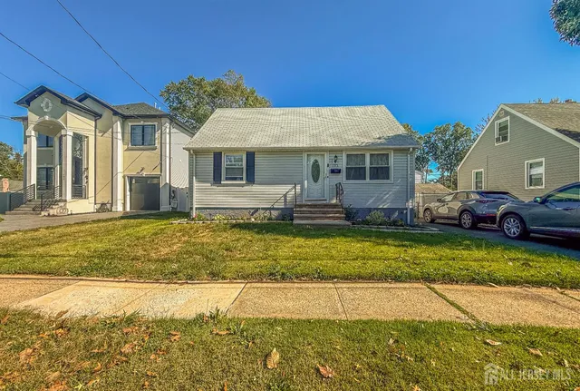 a view of house with outdoor space and swimming pool