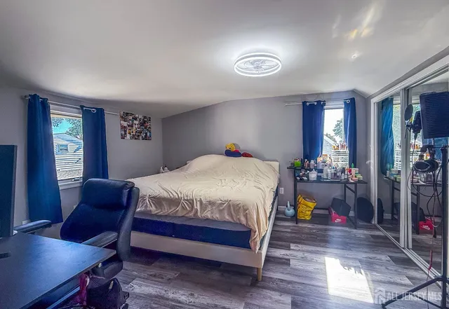 a spacious bedroom with a bed and a desk