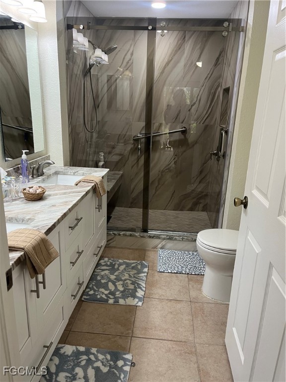 6401 Aragon Way, Unit 107 Fort Myers, FL 33966 - Photo 13 of 28 a bathroom with a sink a toilet and shower