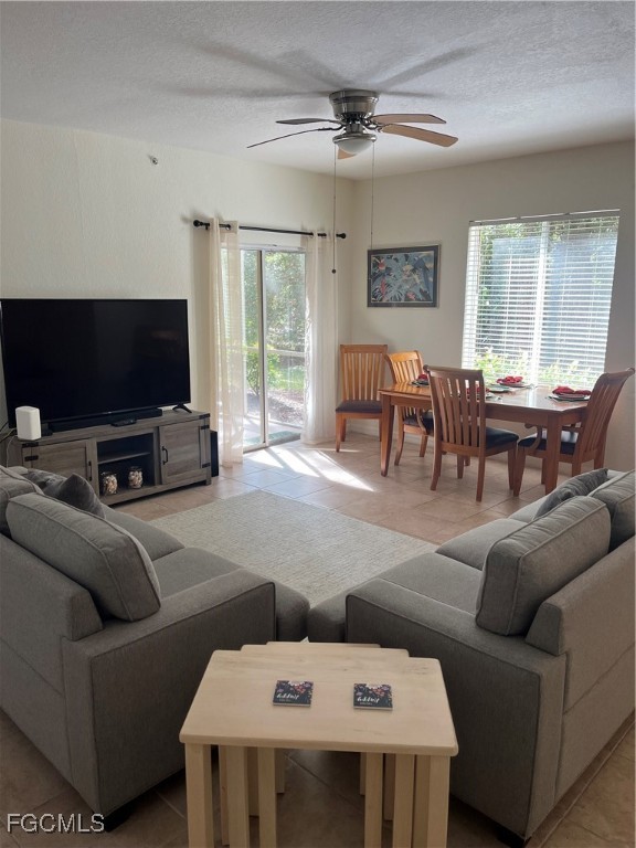 6401 Aragon Way, Unit 107 Fort Myers, FL 33966 - Photo 2 of 28 a living room with furniture and a flat screen tv