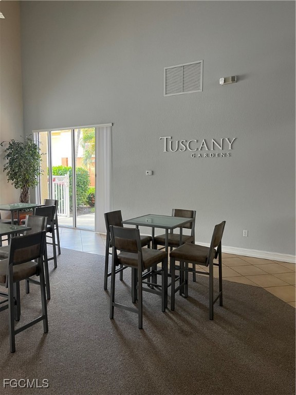 6401 Aragon Way, Unit 107 Fort Myers, FL 33966 - Photo 26 of 28 a view of a dining room with furniture window and outside view