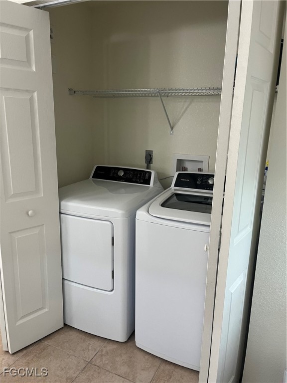 6401 Aragon Way, Unit 107 Fort Myers, FL 33966 - Photo 6 of 28 a utility room with dryer and washer