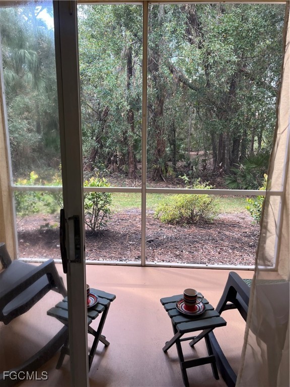 6401 Aragon Way, Unit 107 Fort Myers, FL 33966 - Photo 7 of 28 a view of backyard with green space and seating