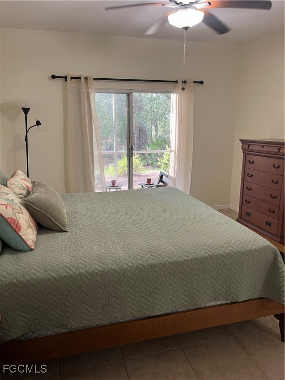 6401 Aragon Way, Unit 107 Fort Myers, FL 33966 - Photo 8 of 28 a bedroom with a bed and a window