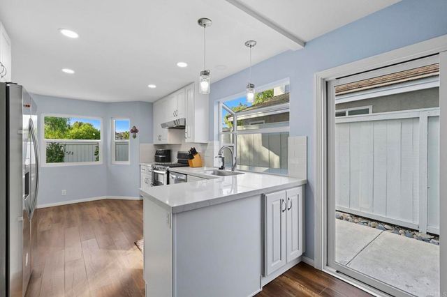 a kitchen with sink cabinets and window