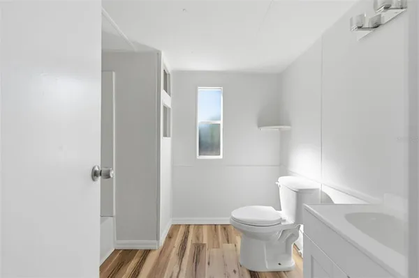 a bathroom with a toilet a sink and bathtub