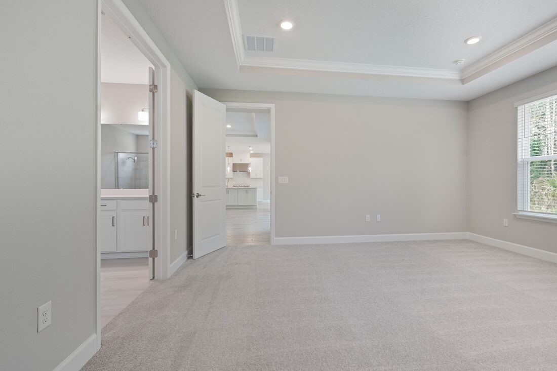 86049 Living Waters Run Yulee, FL 32097 - Photo 15 of 36 an empty room with windows and bathroom
