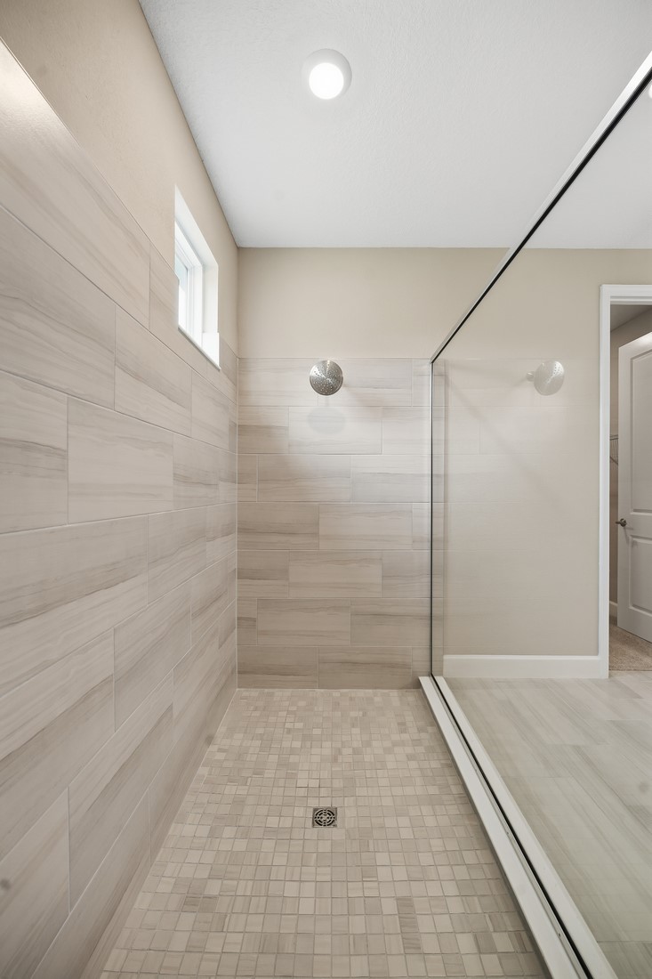 86049 Living Waters Run Yulee, FL 32097 - Photo 21 of 36 a bathroom with a shower