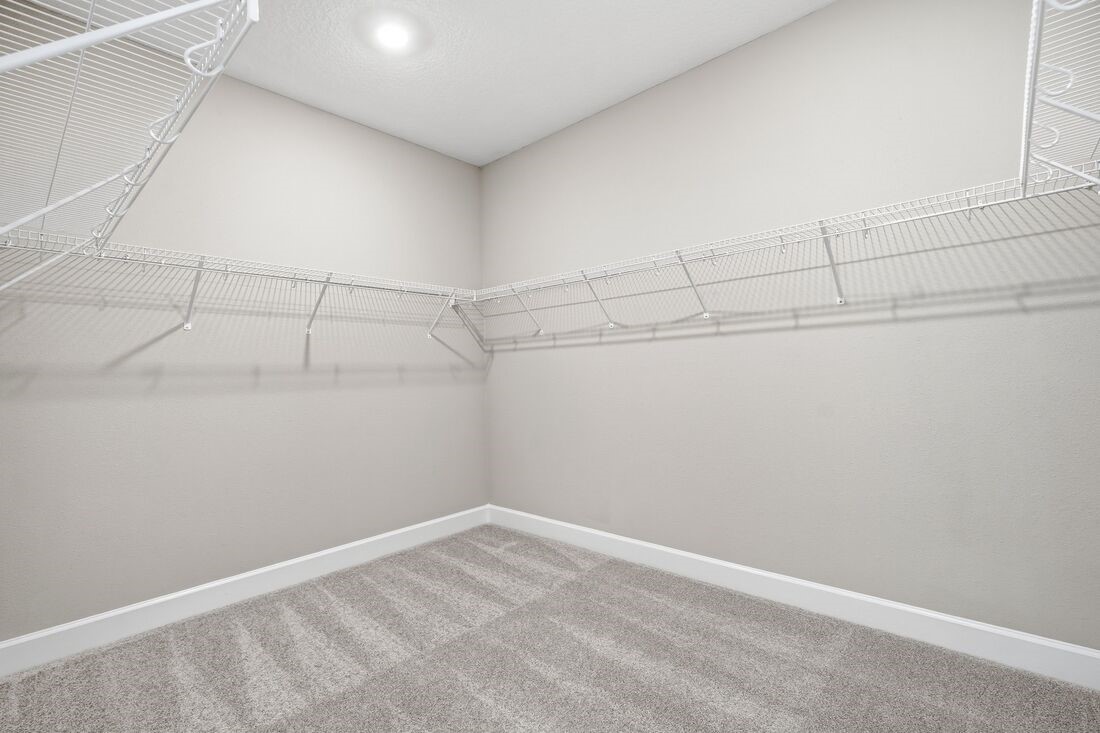 86049 Living Waters Run Yulee, FL 32097 - Photo 22 of 36 a view of a room with racks on the wall