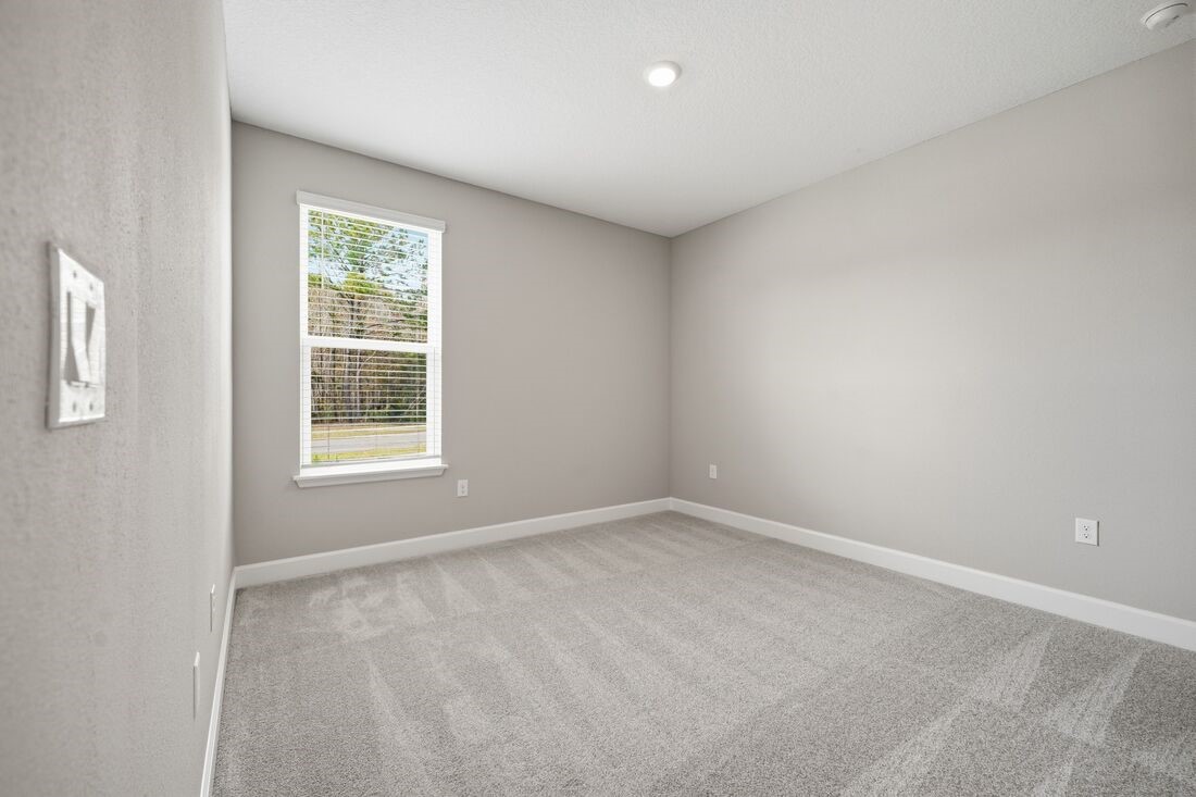 86049 Living Waters Run Yulee, FL 32097 - Photo 23 of 36 an empty room with windows