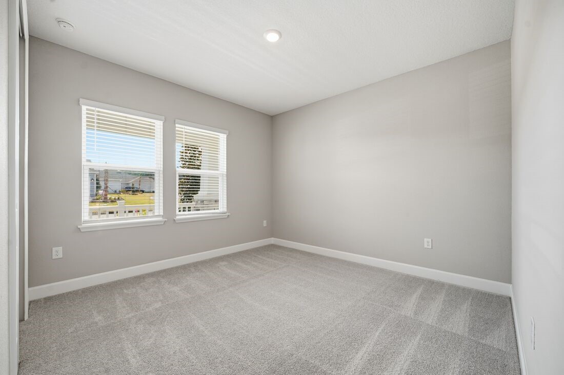 86049 Living Waters Run Yulee, FL 32097 - Photo 24 of 36 an empty room with windows