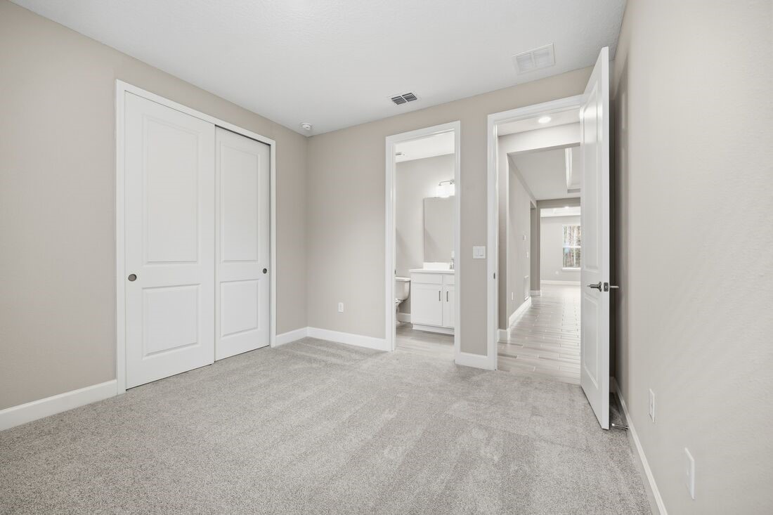 86049 Living Waters Run Yulee, FL 32097 - Photo 25 of 36 an empty room with a bathroom and mirror