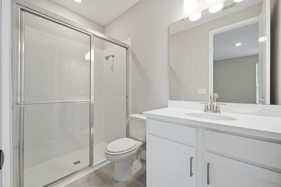 86049 Living Waters Run Yulee, FL 32097 - Photo 28 of 36 a bathroom with a sink a toilet and shower