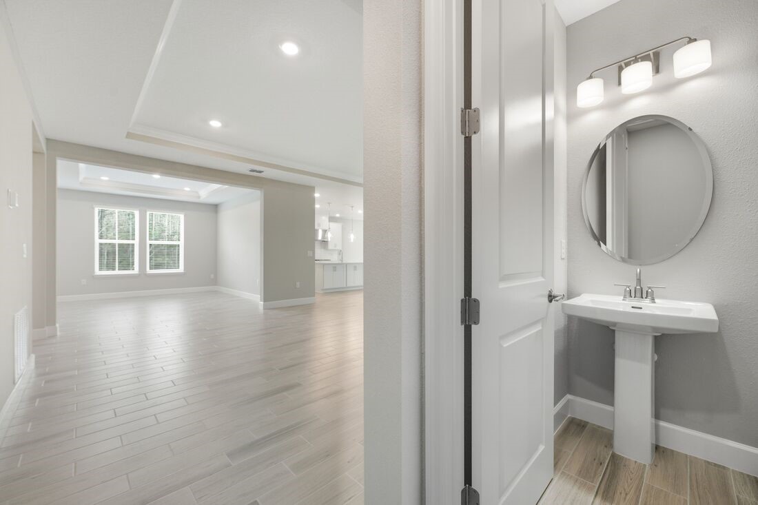 86049 Living Waters Run Yulee, FL 32097 - Photo 30 of 36 a bathroom with a sink and a mirror