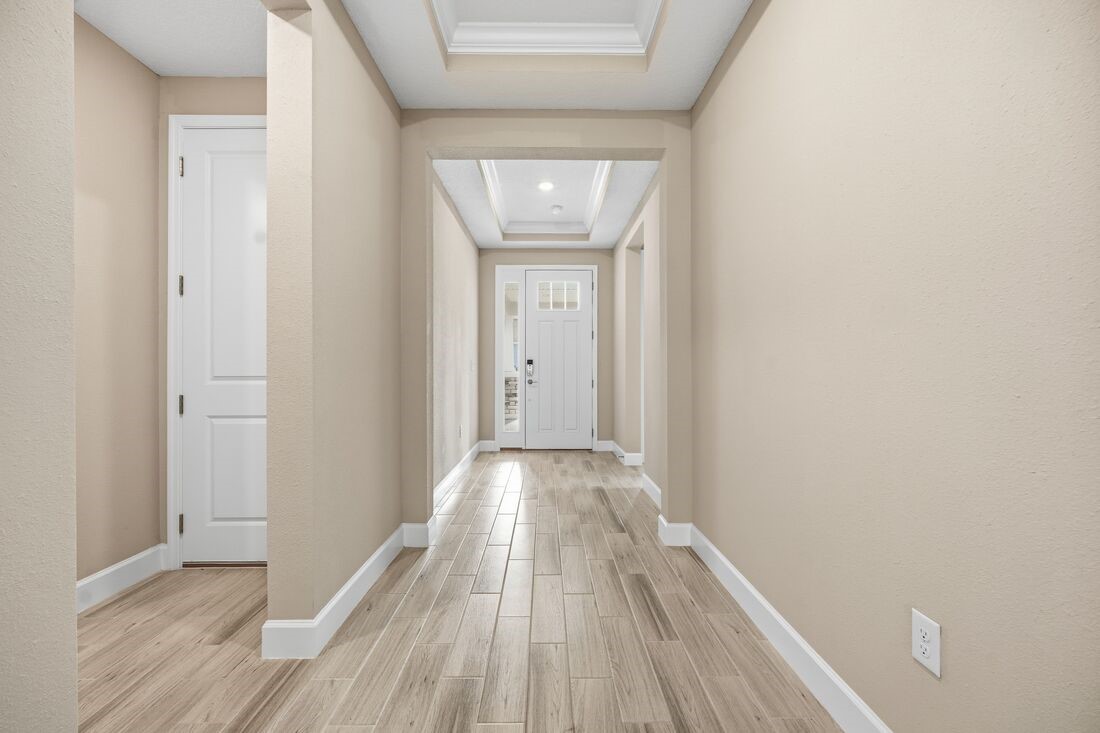 86049 Living Waters Run Yulee, FL 32097 - Photo 31 of 36 a view of hallway with wooden floor