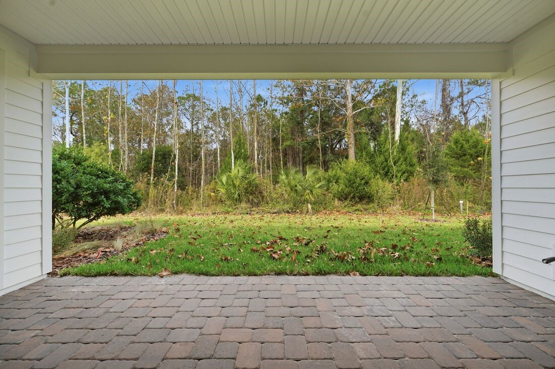 86049 Living Waters Run Yulee, FL 32097 - Photo 33 of 36 a view of backyard with garden