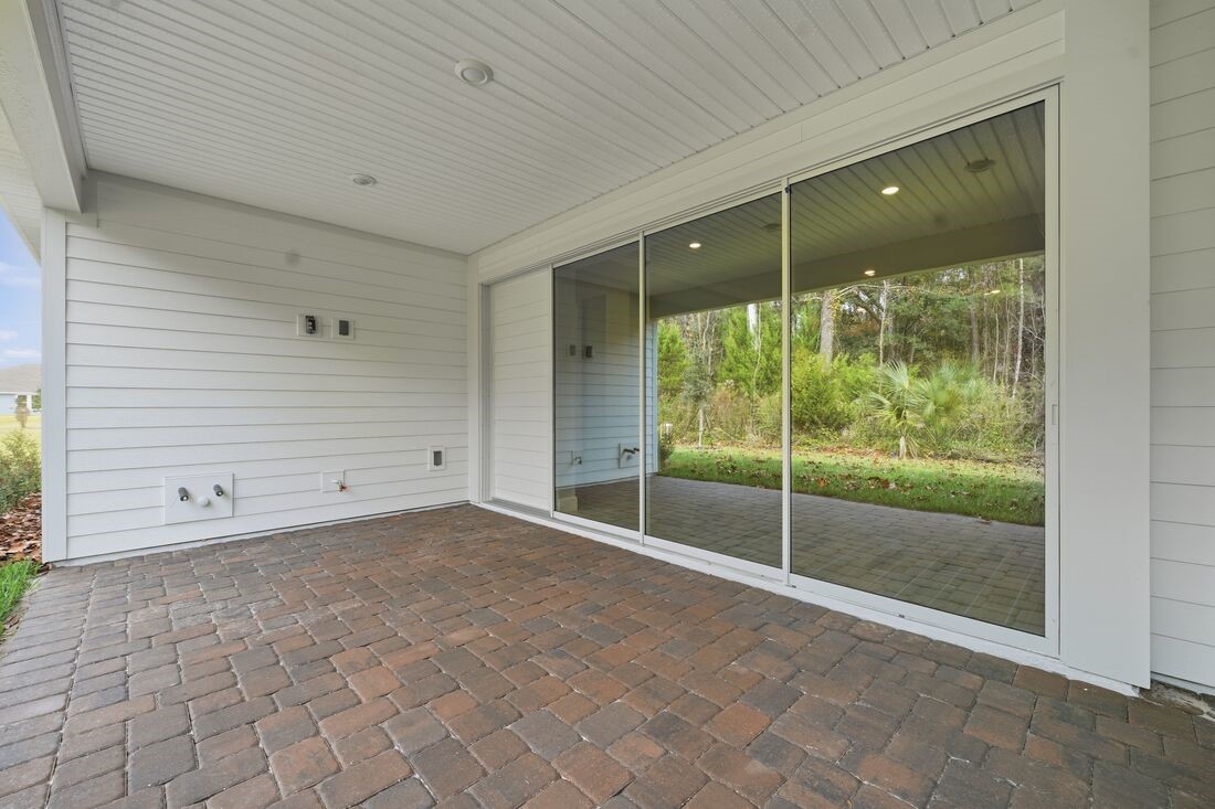 86049 Living Waters Run Yulee, FL 32097 - Photo 34 of 36 a view of an empty room with glass door