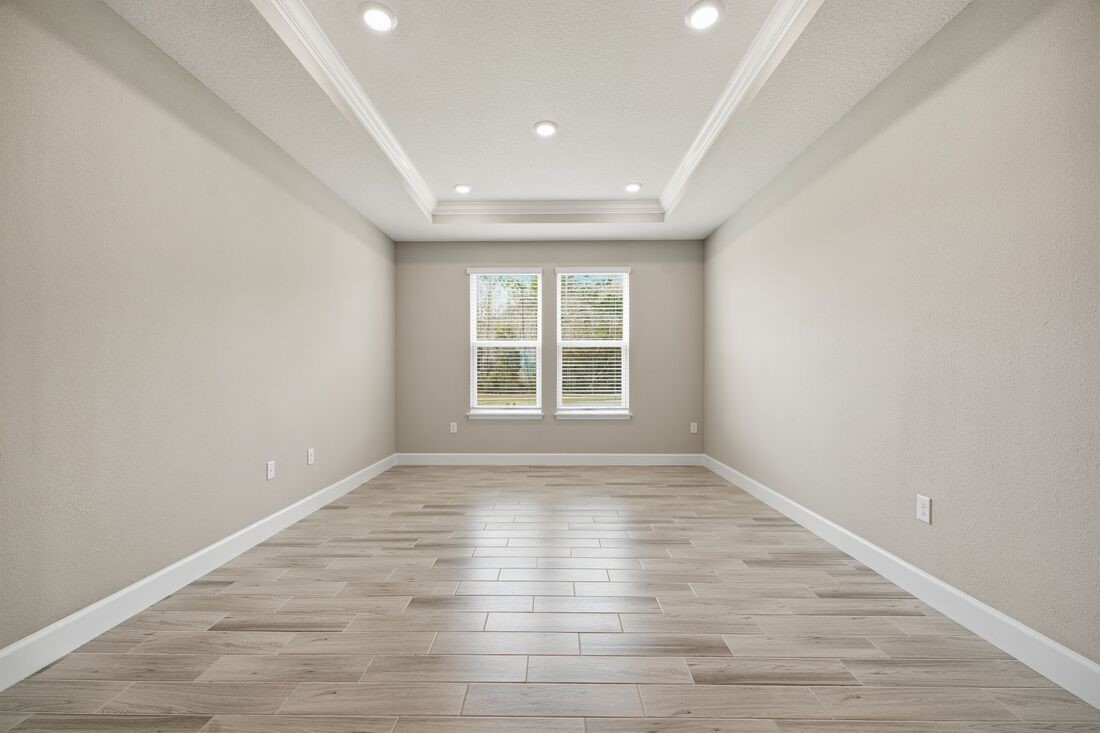 86049 Living Waters Run Yulee, FL 32097 - Photo 6 of 36 wooden floor in an empty room with a window