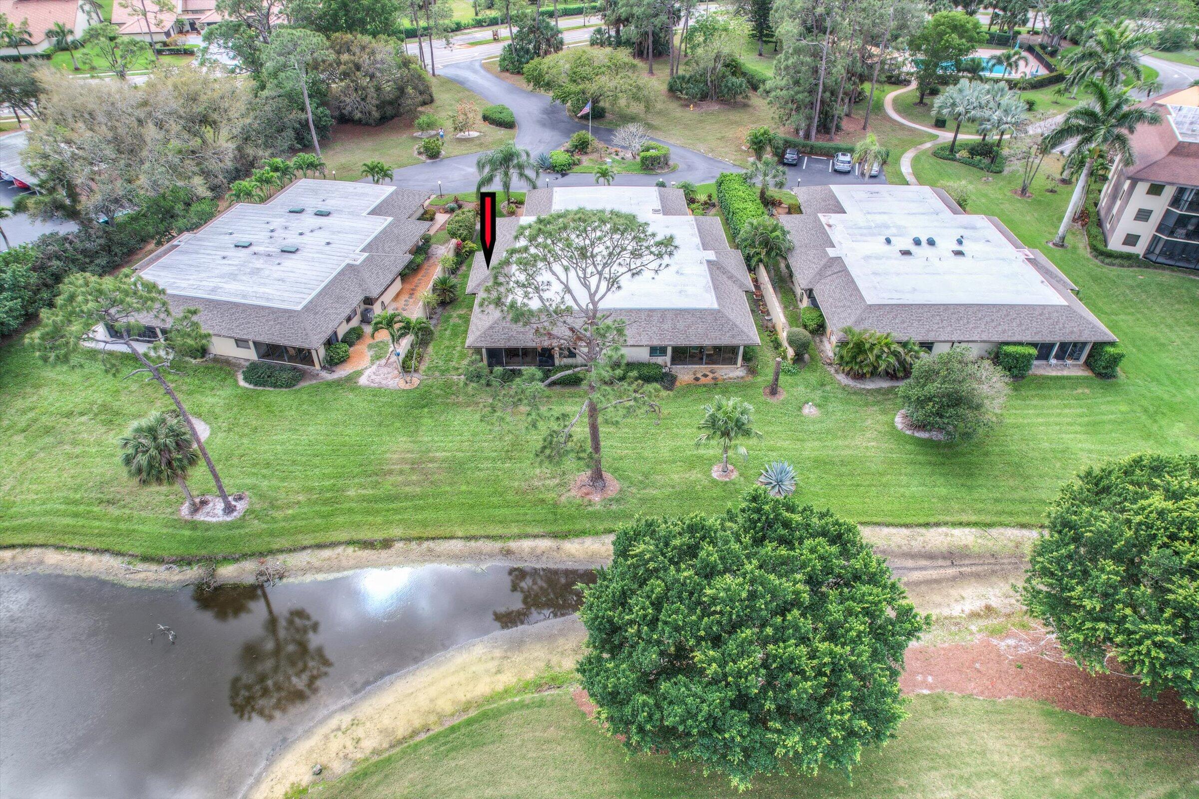 535 Augusta Boulevard, Unit 4 Naples, FL 34113 - Photo 4 of 44 an aerial view of a house with garden space and street view