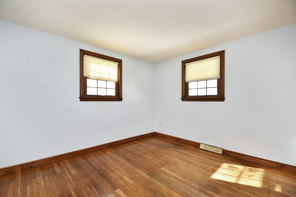 72 Old Bolton Road Hudson, MA 01749 - Photo 14 of 42 a view of empty room with wooden floor and fan