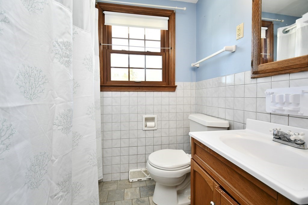 72 Old Bolton Road Hudson, MA 01749 - Photo 18 of 42 a bathroom with a sink a toilet and a window