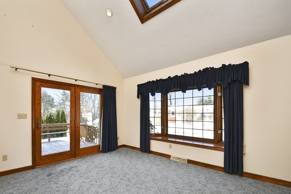 72 Old Bolton Road Hudson, MA 01749 - Photo 2 of 42 an empty room with windows