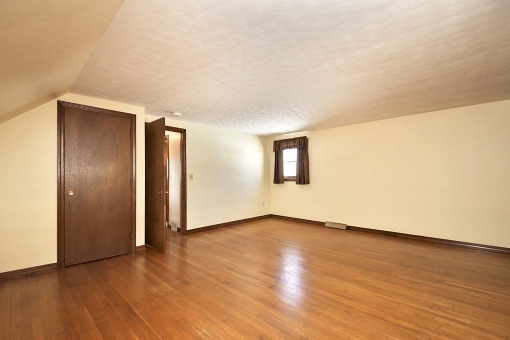 72 Old Bolton Road Hudson, MA 01749 - Photo 21 of 42 a view of an empty room and wooden floor
