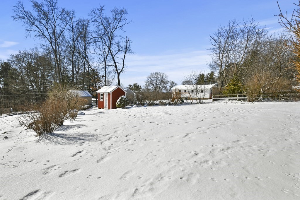 72 Old Bolton Road Hudson, MA 01749 - Photo 35 of 42 a view of a yard with snow