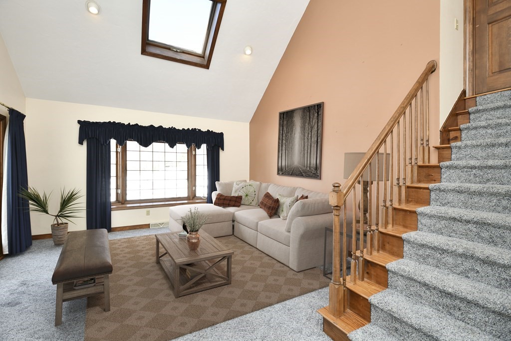72 Old Bolton Road Hudson, MA 01749 - Photo 4 of 42 a living room with furniture or couch and a large window