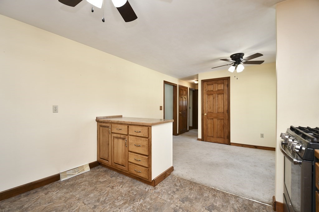 72 Old Bolton Road Hudson, MA 01749 - Photo 7 of 42 a view of an empty room with a ceiling fan