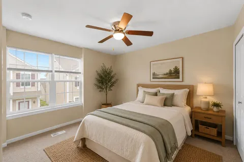 a kitchen with stainless steel appliances granite countertop a stove top oven a refrigerator a sink and a island