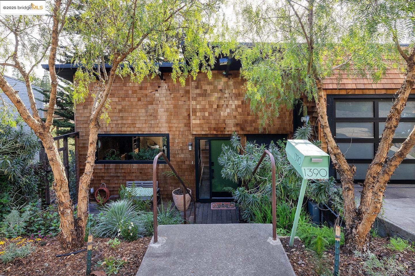 1390 Summit Road Berkeley, CA 94708 - Photo 1 of 1 a front view of a house with a tree