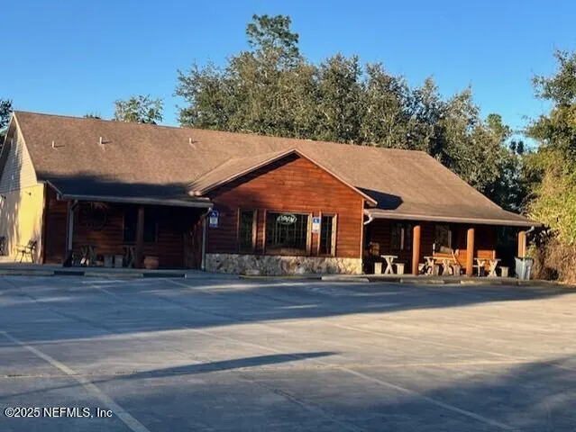 a front view of a building and trees